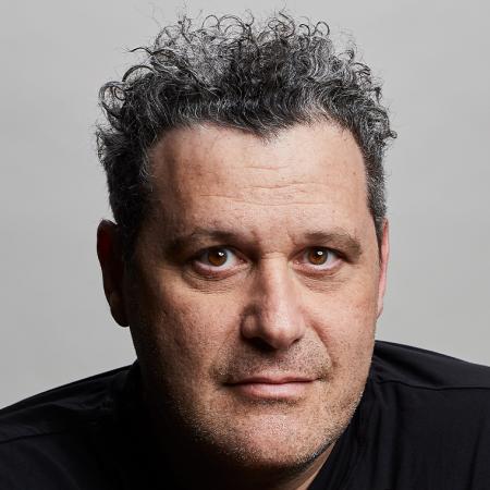 Isaac Mizrahi in a dark top