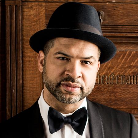 Jason Moran in a black hat and bowtie